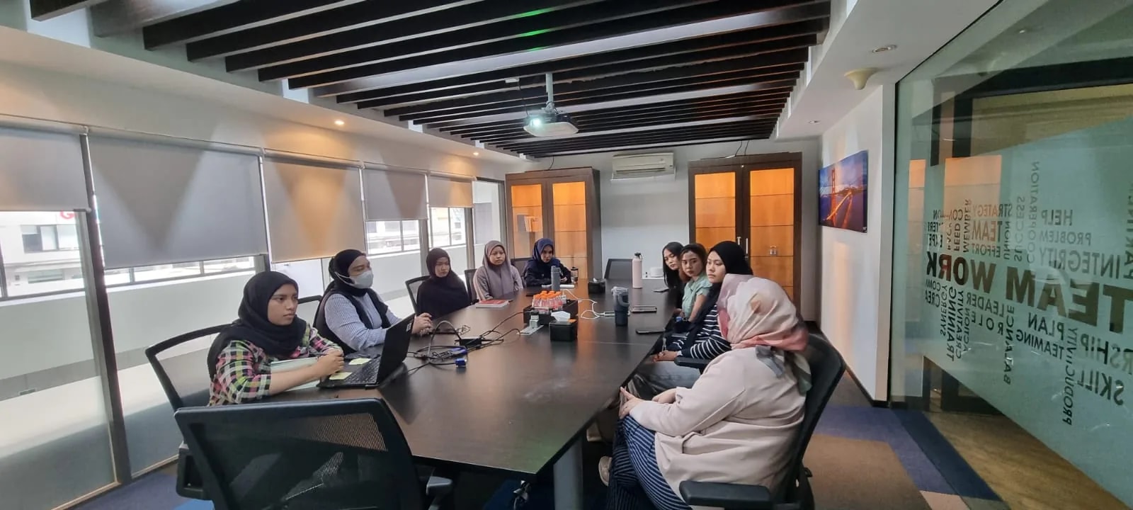 MDP crew in a session with the team collaboration wall behind them.
