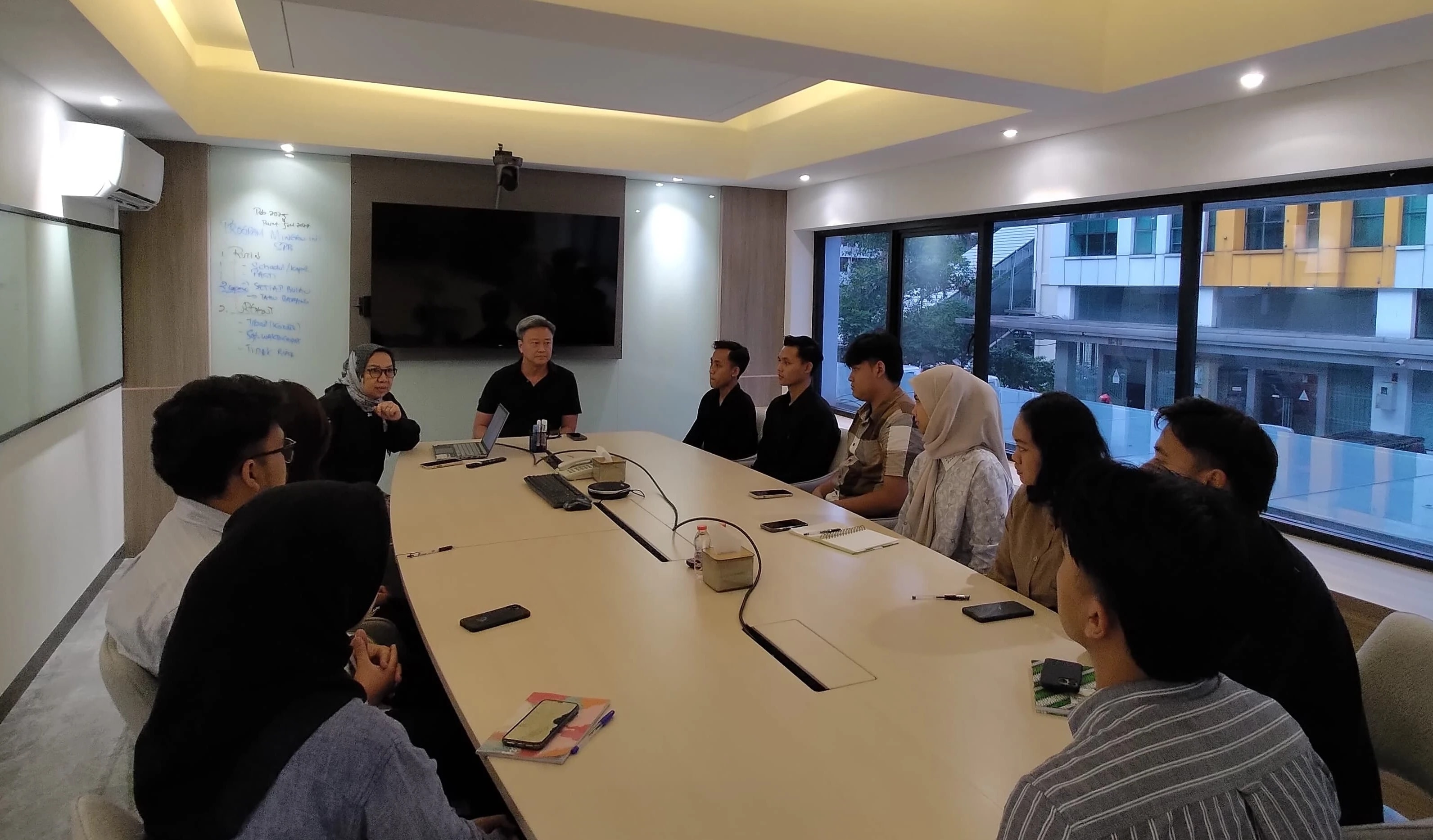 MDP crew in a session, led by a facilitator in front of a whiteboard.